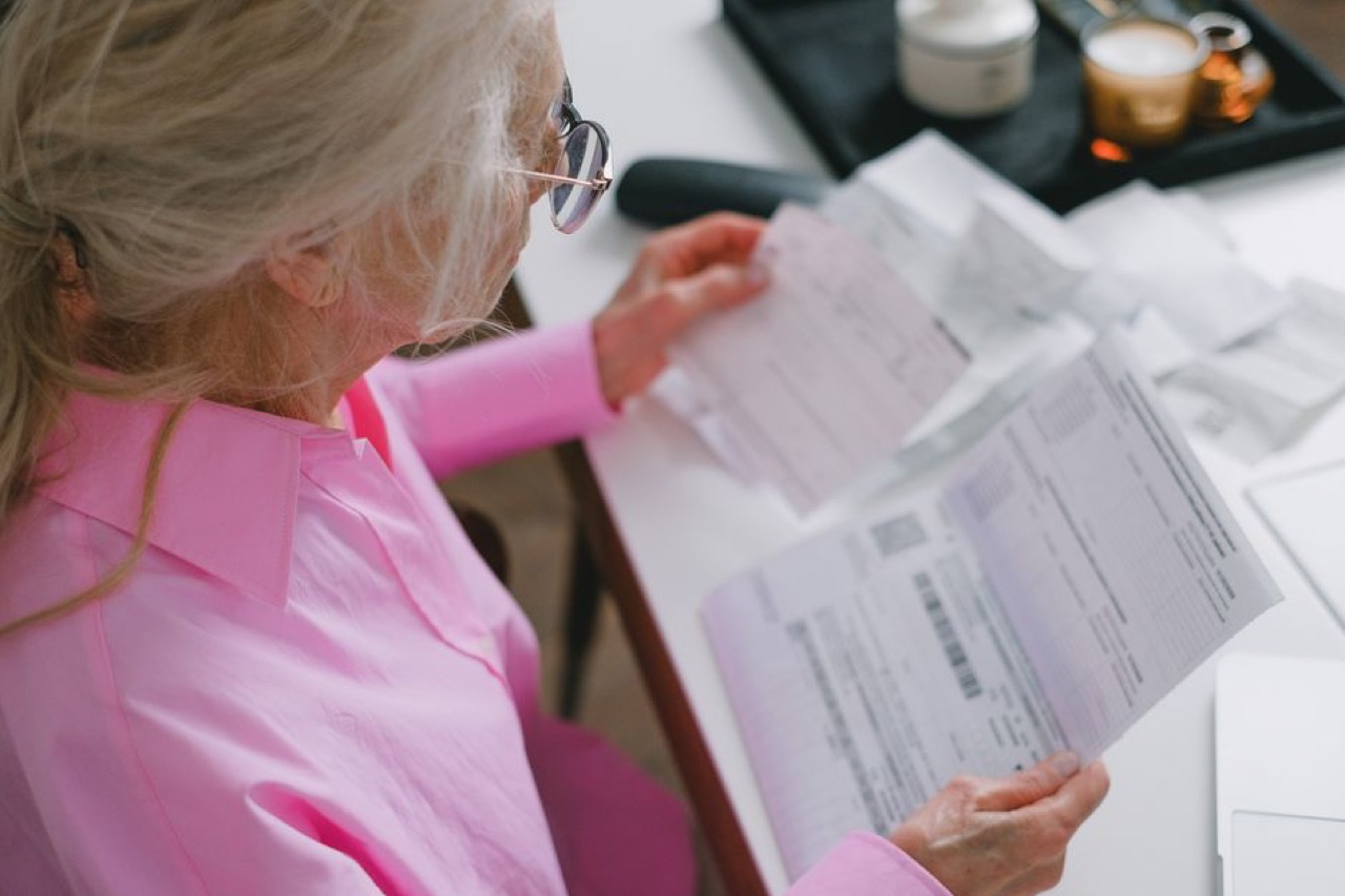 Low income medical aid in South Africa Reviewing bills at desk