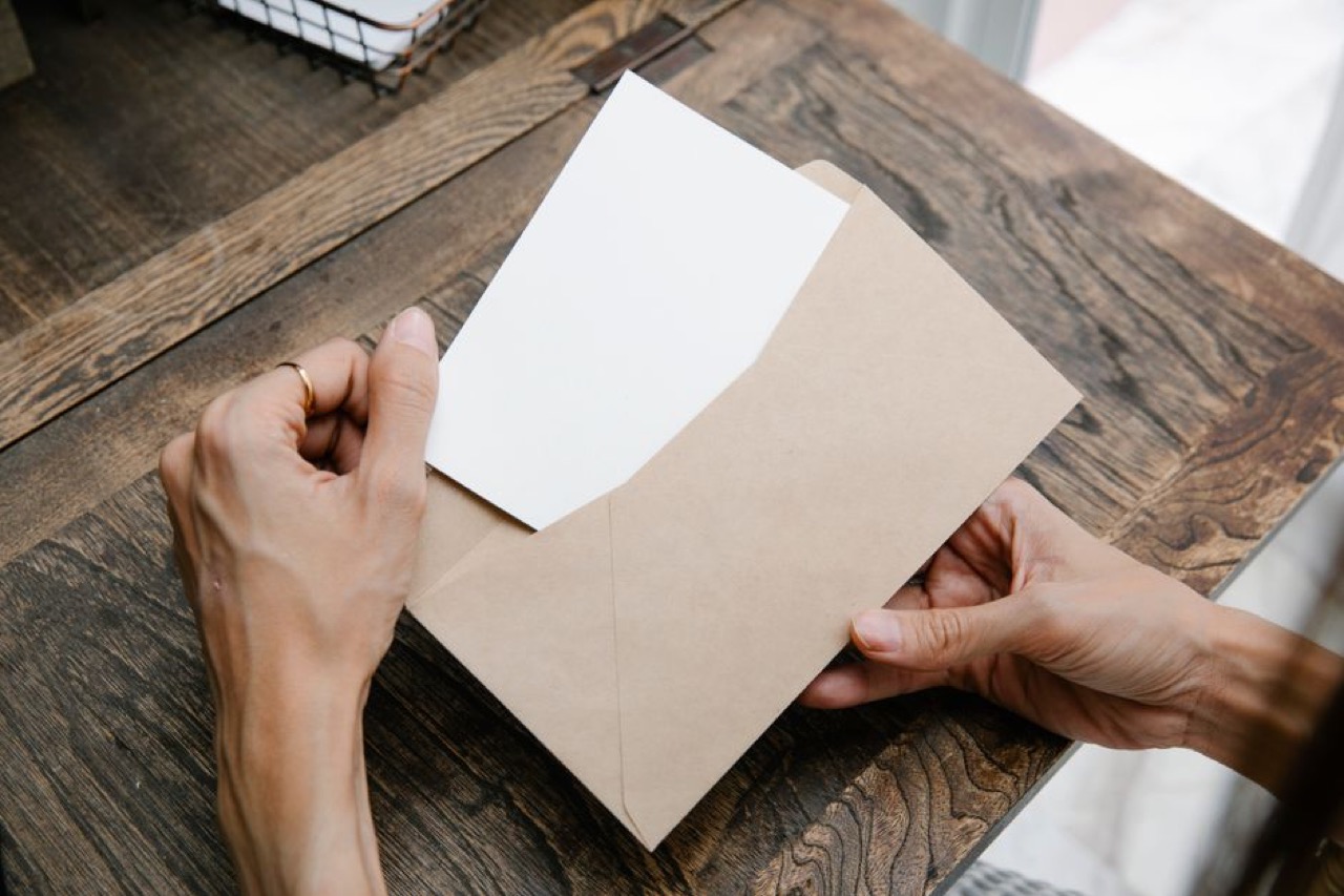 Letter to add or remove a dependant template Reading a letter at desk