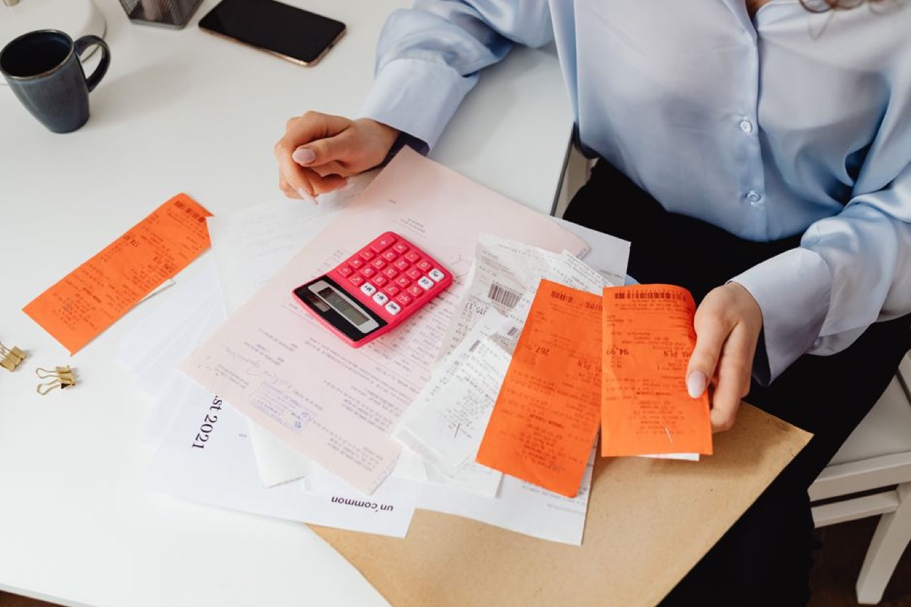 Medical aid contribution calculator guide Reviewing bills at desk